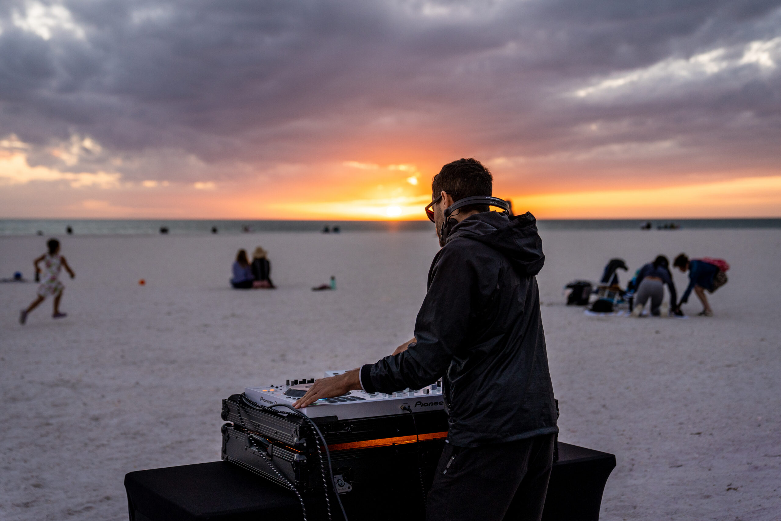 Crowd on the beach at sunset